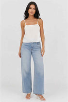 White satin women’s tank top with thin spaghetti straps and straight neckline, front view