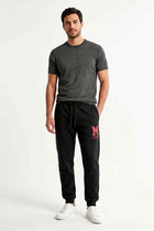 Black men’s embroidered jogger trousers with drawstring waist and side logo