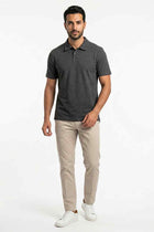 Men's anthra melange polo shirt in dark heather, short sleeves and 3-button placket; front view.