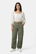 White off-shoulder blouse with puff sleeves and smocked bodice
