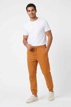 Brown men’s drawstring jogger pants, tapered legs and elastic cuff hem