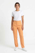 Women's straight-fit pleated pants in warm beige-orange, front view on model