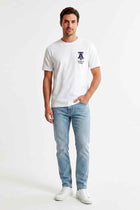 Men's white slogan T-shirt with small chest logo, front view, short sleeves