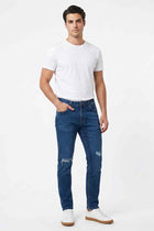Men's slim-fit mid blue jeans with distressed knee rips and zip fly