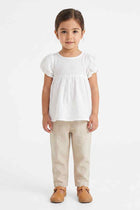White baby girls blouse with puff sleeves and gathered front