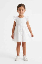 White embroidered baby girls’ dress with front buttons and ruffled cap sleeves
