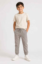 Boys' grey drawstring jogger trousers with elastic waist and tapered legs