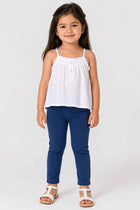Mid-blue baby jeggings on a child, cuffed ankle hem and elastic waist
