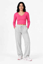 Hot pink long-sleeve women’s seamless T-shirt, front view, scoop neck, fitted knit
