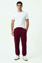 Men's rose wood jogger trousers with drawstring waist and tapered ankle cuffs