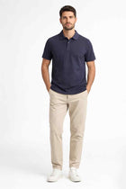Men's classic polo shirt in dark navy blue with short sleeves and button placket