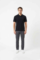 Men's black polo shirt with short sleeves and buttoned collar