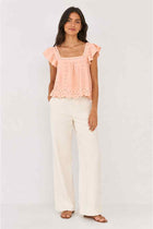 Pink embroidered ruffle blouse for women with flutter cap sleeves and eyelet lace pattern