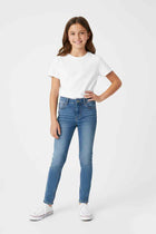 Girls' mid-blue skinny jeans with five-pocket design and zip button closure