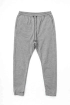 Light grey men's jogger trousers with elastic waistband and drawstring, tapered legs