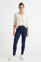 Women wearing navy stretch leggings with elastic waistband and ankle-length hem.
