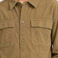 Brown boys corduroy button-down shirt with button front and chest pockets