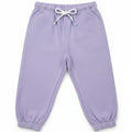 Lilac baby jogger trousers, flat lay with white drawstring and cuffed hems