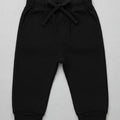 Black baby jogger trousers flat lay, elastic waistband with drawstring, cuffed hems
