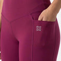 Purple women’s high-waist legging with side pocket and stitched panel