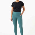 Women’s teal leggings, ankle length with stitched seams and side pocket