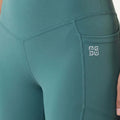 Teal leggings with contrast-stitched pocket and embossed logo on hip