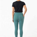 Women’s teal leggings with high-rise waistband, full-length skinny fit