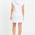White women's sleeveless hoodie dress on model, back view with hood.