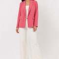 Womenâ€™s pink tailored blazer with notch lapels and button front