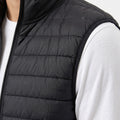 Black quilted puffer vest with full-length front zipper and stand collar