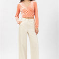 Peach velvet wrap blouse for women with V-neck, long sleeves, and ruched wrap