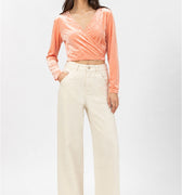 Peach velvet wrap blouse for women with V-neck, long sleeves, and ruched wrap