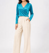 Women's teal velvet wrap blouse with V-neck and long sleeves