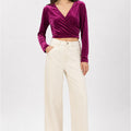 Prune velvet wrap blouse with long sleeves, V-neck, and cross-over front