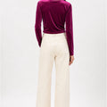 Prune velvet wrap blouse back view with long sleeves and V-shaped neckline