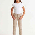 Beige girls slim pants front view with button fly and front pockets