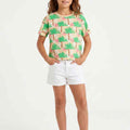 Girls' cropped graphic T-shirt, front view, light beige with green palm print, crew neck