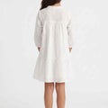 White girls' cotton dress, back view, gathered yoke and tiered skirt, three-quarter sleeves