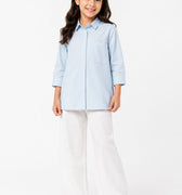 Light blue girls button-up solid shirt with pointed collar, long sleeves