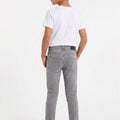 Light grey skinny denim jeans for boys, back view with belt loops and back pockets