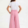 Girls mauve wide-leg trousers, back view, elastic waistband and side pockets