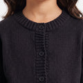 Black knit cardigan for girls with ribbed crew neck and button placket detail
