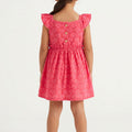 Pink printed baby girl dress, back view with ruffled cap sleeves and button detail