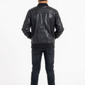 Black faux leather bomber jacket for boys, back view with ribbed hem and cuffs