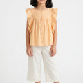 Girls deep peach sleeveless ruffle blouse with gathered yoke, front view