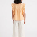 Girls deep peach sleeveless ruffle blouse with gathered yoke, back view