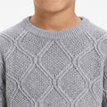 Light grey diamond knit crew-neck boys sweater, textured stitch pattern close-up