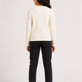 Girls' ecru ribbed-knit sweater, back view with vertical stripe texture