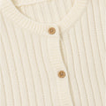 Ecru knit sweater collar with round neck ribbing and tan button placket