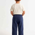 Navy baby boys jogger trousers, back view, elastic waistband and cuffed hems